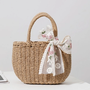 Khaki straw tote bag with pink flower embroidery and white lace ribbon for beach holidays