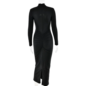 Detailed back view of a slim black dress featuring a concealed zipper and elegant ruching