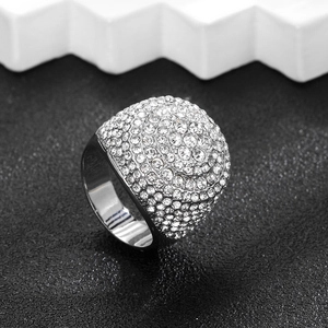 Macro detail of silver tone dome ring with pave set clear cubic zirconia stones