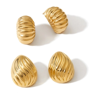 Golden wavy geometric earrings set featuring teardrop and semi-circle metal patterns