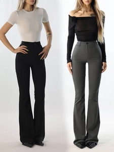 Detail view of high-waisted flared trousers in black and dark grey with button closure