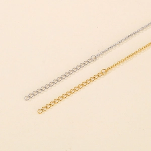 Detail of adjustable stainless steel extension chains in gold and silver finishes