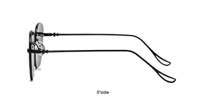 Close-up of rimless sunglasses featuring a cross hinge detail on metal temples