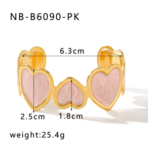 Detail view of pink enamel heart bangle in gold-plated steel with size and weight specs