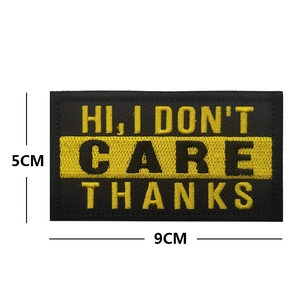Macro detail of 9cm x 5cm black and yellow embroidered patch with fun English slogan