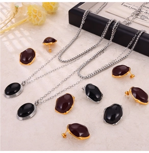 British vintage jewelry set featuring enamel pendants with necklaces and earrings