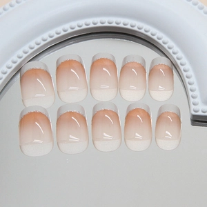 French gradient press-on nails with creamy white tips and silver glitter highlights
