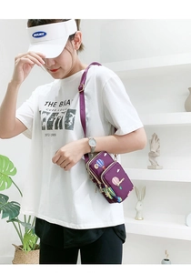 Detail view of purple nylon crossbody phone bag with multi-layer zippers and balloon print