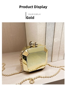 Close-up of golden octagonal evening bag with metallic mirror finish and bead chain strap