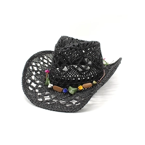 Detail of black hollow woven straw cowboy hat with colorful mineral stones and beads