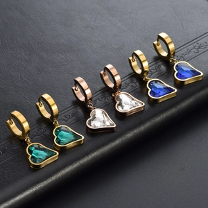 Three pairs of heart pendant earrings in gold and rose gold with colorful gemstones