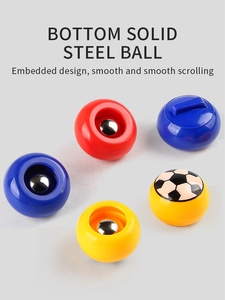 Detail view of colorful game pucks showing bottom solid steel balls for smooth gliding