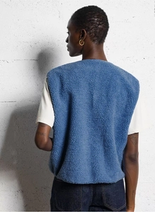 Rear view of blue faux shearling vest showcasing premium fleece texture and clean cut