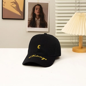 Classic black cotton baseball cap featuring yellow embroidered C and Chicago script detail