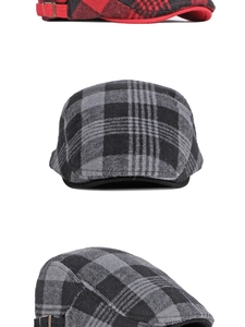 Detailed view of red and grey plaid beret hats with adjustable metal side buckles