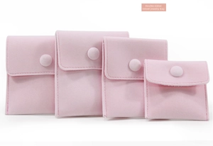Pink velvet jewelry pouches with snap button closure in four different sizes