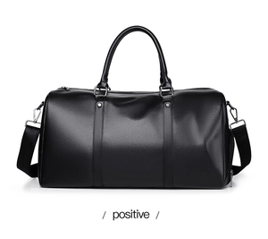 Front view of black PU leather sports bag with twin handles and adjustable shoulder strap