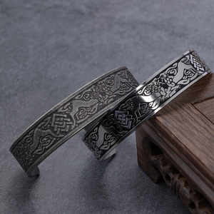 Dual dragon-style stainless steel open bangles with vintage and polished finishes