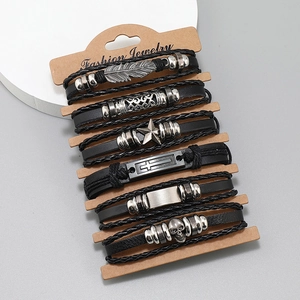 Set de 6 pulseras de cuero trenzado con dijes de metal de calavera, estrella y pluma