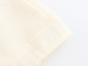 Macro shot of French style beige cotton-linen fabric texture and detailed stitching