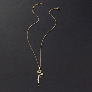 Detailed close-up of custom Sophia name necklace with a golden flower pendant