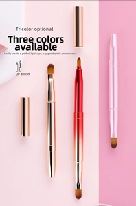 Detailed view of retractable dual-headed metal lip brushes in three gradient finishes