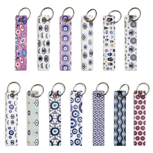 Faux leather Evil Eye and Hamsa keychains set with vibrant bohemian prints and metal rings