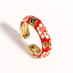 Adjustable gold flower ring with red enamel coating and intricate floral patterns