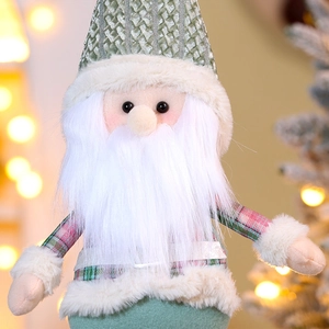 Close-up of a Christmas elf plush with gray-green knit hat and soft white faux fur beard