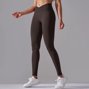 Detail of high-waist seamless yoga pants with V-cross waistband in dark chocolate brown