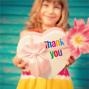 White heart-shaped gift box with pink ribbon bow and colorful Thank You text