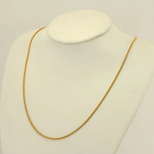 18K gold plated stainless steel necklace displayed on a white neck bust mannequin