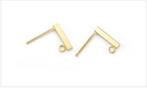 Macro shot of gold S925 sterling silver rectangular bar earrings with small hanging rings