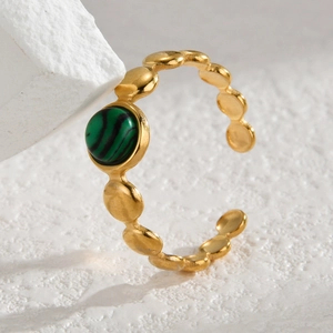 Macro shot of 14K gold-plated stainless steel ring with green malachite gemstone detail