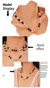 Detail of beaded black onyx and white shell necklace with gold OT clasp on model