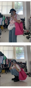 Pink canvas tote bag with UNIZP label shown in a lifestyle casual setting on shoulder