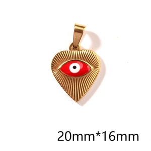 Detailed view of a gold heart-shaped evil eye pendant with 20mm x 16mm dimensions