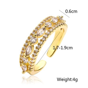 Detailed view of gold plated geometric ring with dimensions and cubic zirconia inlay