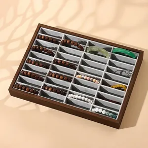 Schmucktablett aus Palisander-Maserung mit 24 Fächern für Armbänder und Uhren