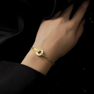 Elegant gold double-chain bracelet with shell inlay and BELOVE engraving on black silk