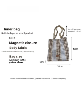 Detail view of cotton patchwork tote bag with brown plaid and blue stripes and dimensions