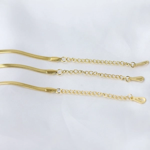 Close-up of 14K gold plated brass snake chain bracelet with adjustable extender links