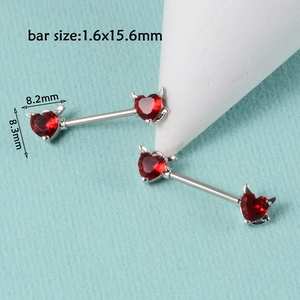 Macro view of red heart devil nipple rings with dimensions 1.6x15.6mm on silver bars