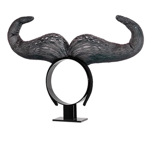 Close-up of Halloween ox horn headband featuring detailed dark grey printed fabric texture