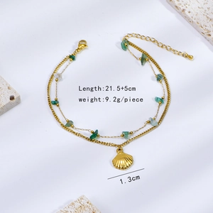 Double-layer gold anklet with natural green stones and a shell pendant on a white background