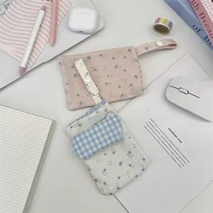 Detail of floral nurse pocket protectors with button straps on a tidy desktop