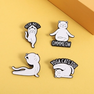 Set of 4 cute white cat yoga enamel pins with Meowmaste text on yellow background