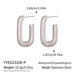 Close-up of minimalist U-shaped stainless steel earrings with waterproof silver finish
