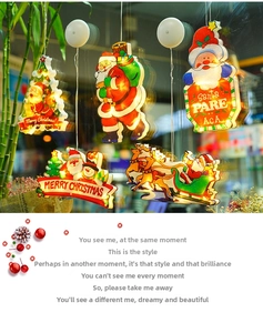 Detail of LED Christmas suction cup window lights featuring Santa and reindeer designs