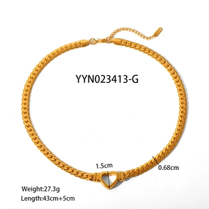 Gold hollow heart cuban link chain necklace in stainless steel on white background